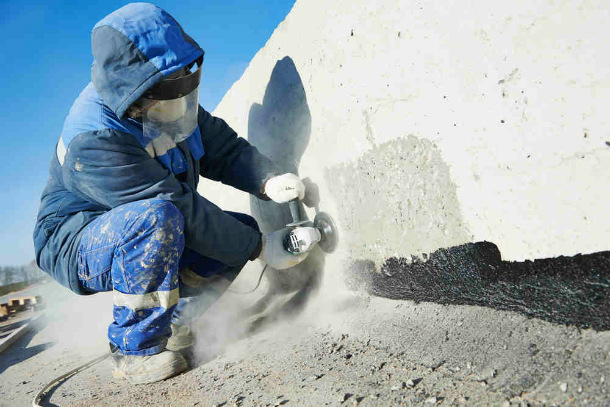 worker with complete safety and dust protection gear
