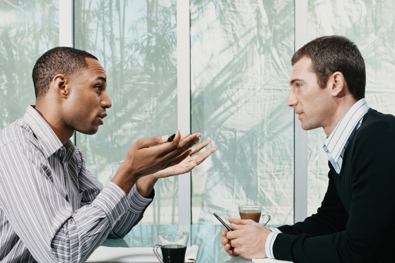 Two men conversing