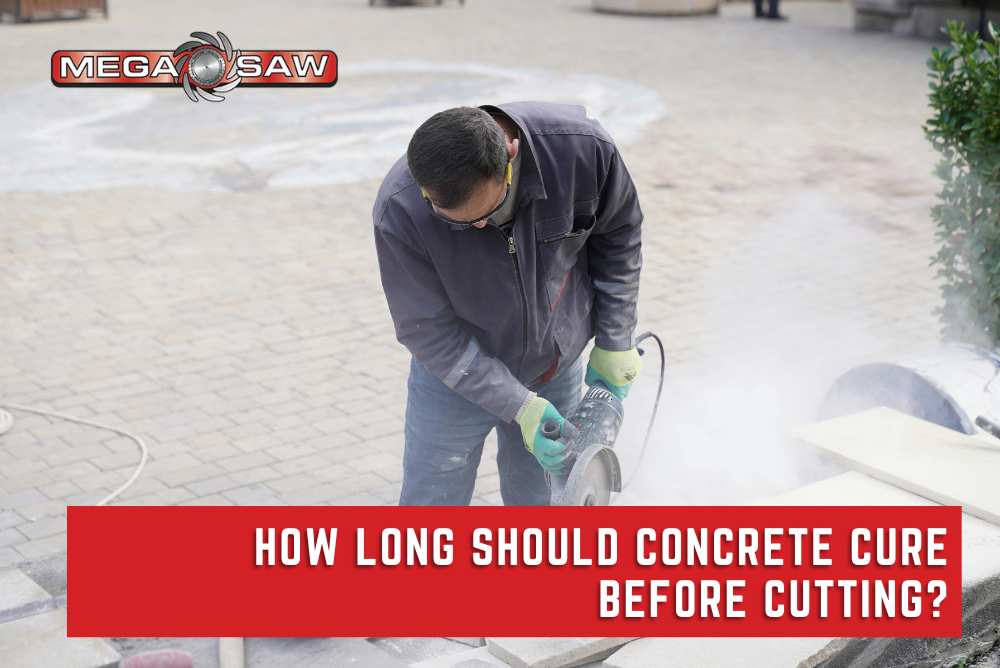 Construction worker using a concrete saw to cut a newly cured concrete slab, demonstrating the proper timing for concrete cutting after curing.